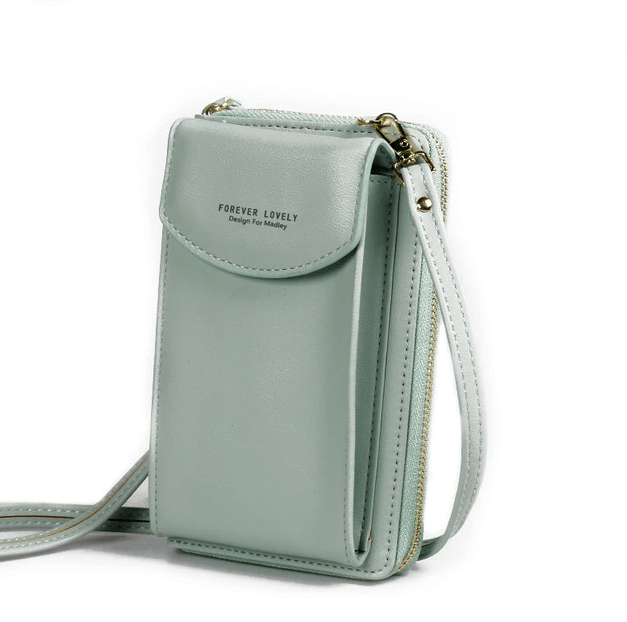 Detail of adjustable strap on women's compact PU leather crossbody shoulder bag.