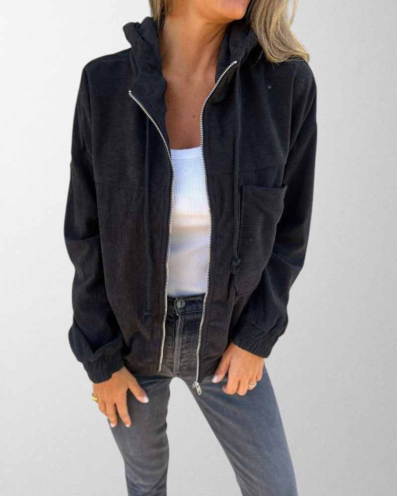 Fashionable women's hooded corduroy jacket with a zip front, essential for versatile casual wear.