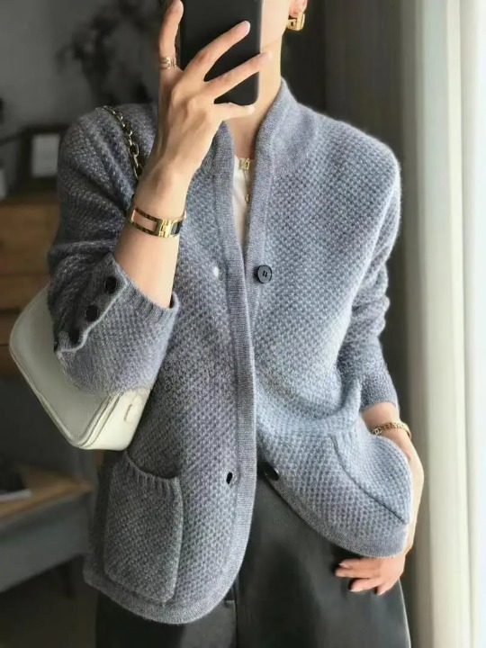 Women's cozy button front knit cardigan in a neutral color, perfect for winter fashion.