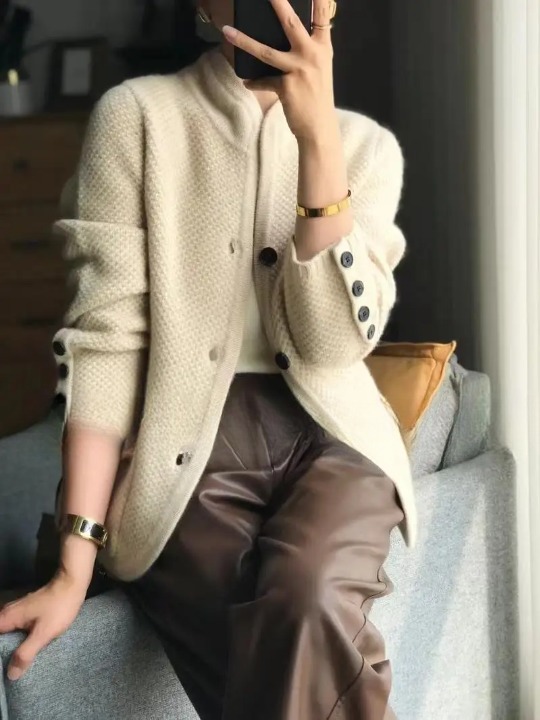 Comfortable women's long sleeve button front cardigan, showcasing its soft knitwear texture.