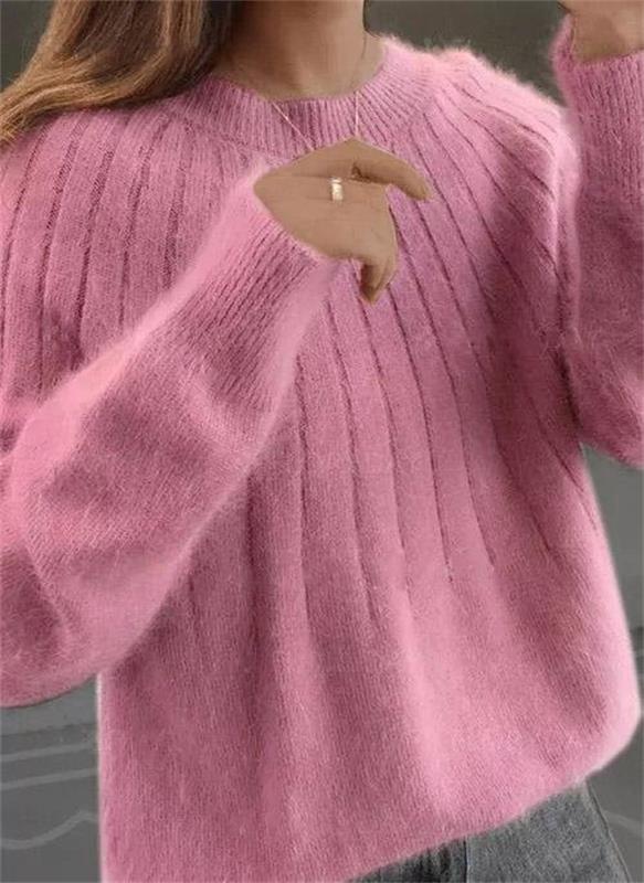 Stylish women's longsleeve knit sweater in a modern design, ideal for winter comfort.