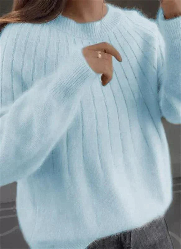 Elegant women's winter knit sweater, versatile for everyday wear and providing cozy warmth.