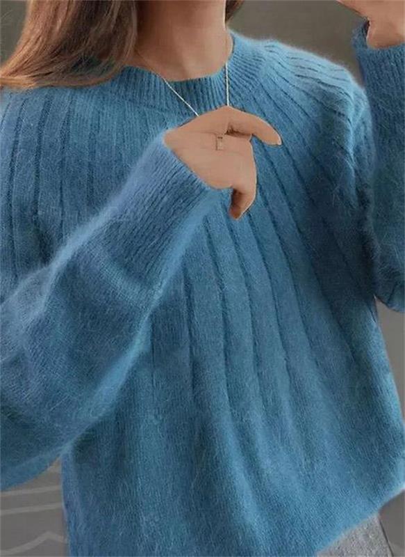 Cream modern knit sweater for women, designed for ultimate winter comfort and contemporary fashion.