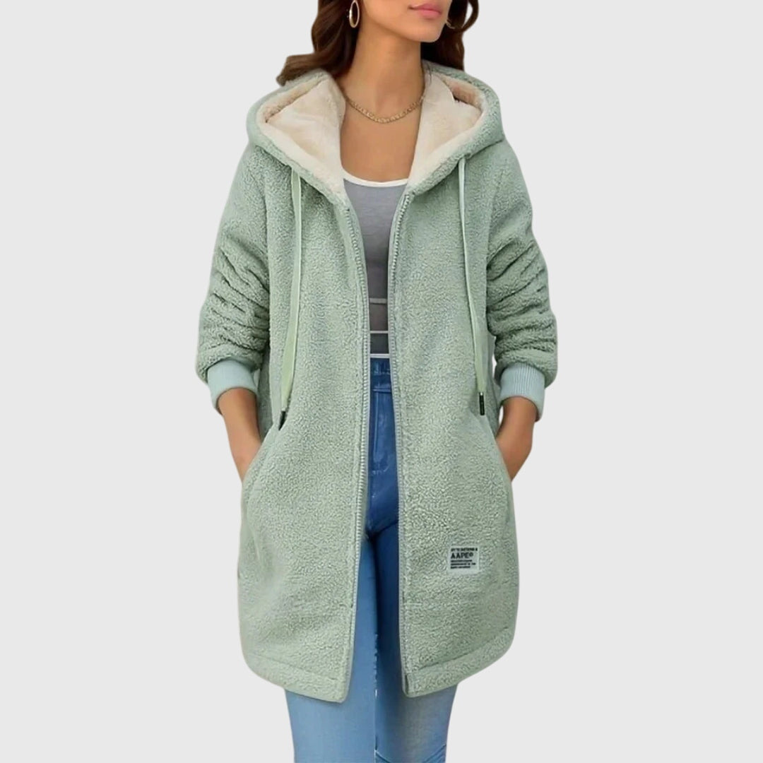 Model wearing a comfortable women's hooded fleece jacket, great for warmth and everyday style.
