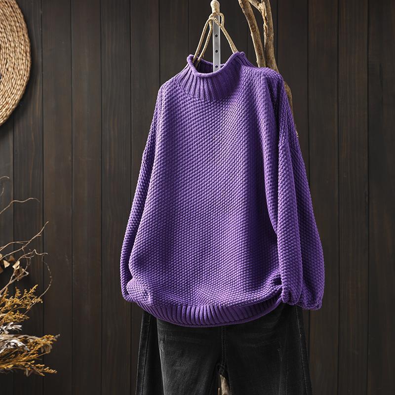 Close-up of a women's knit round neck long sleeve sweater texture, cozy and relaxed fit.