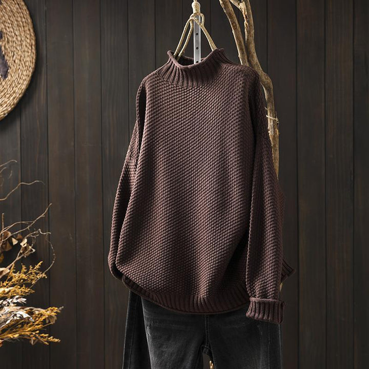 Model wearing a women's round neck knit sweater with long sleeves, suitable for casual outfits.