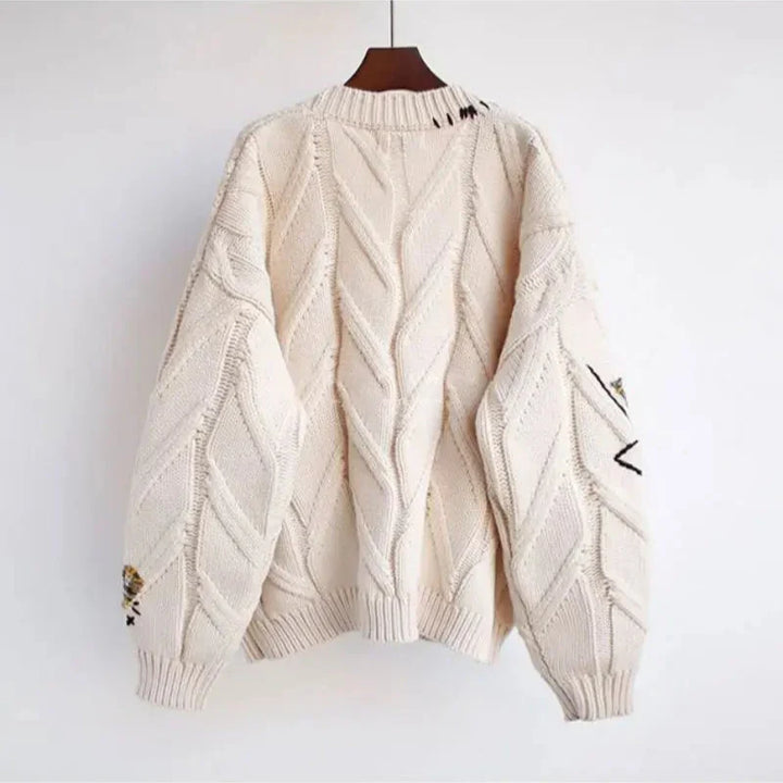 Warm winter women's knit cardigan, V-neck style with an elegant patchwork embroidered pattern.