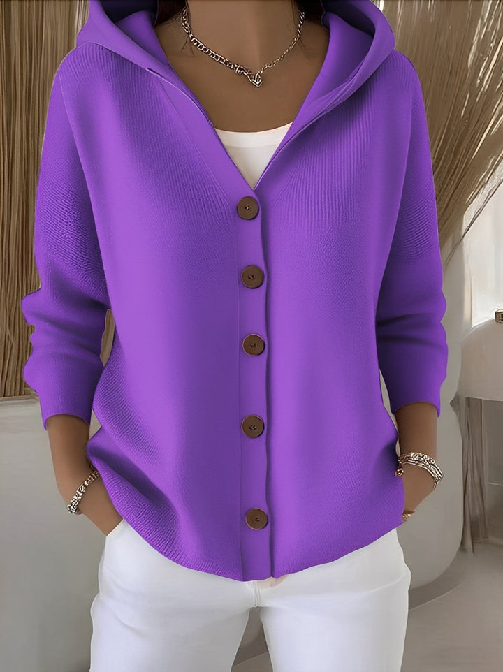 Women's long-sleeve hooded cardigan with practical button closure, offering cozy warmth and style.
