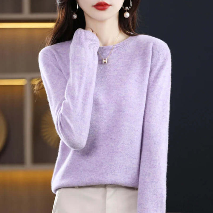 Elegant women's warm apparel: a cozy knitted jumper for stylish winter comfort.