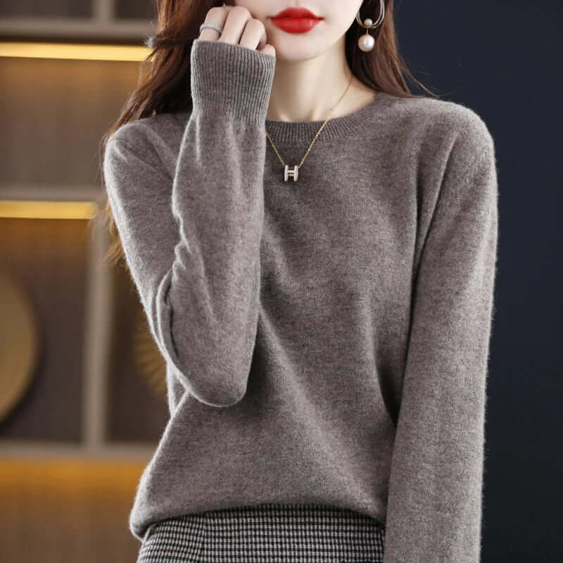 Warm women's apparel: a cozy knitted sweater for stylish everyday comfort.