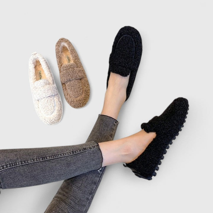 Women's cozy lambswool lined house slippers, tan with elegant design, for ultimate indoor comfort.