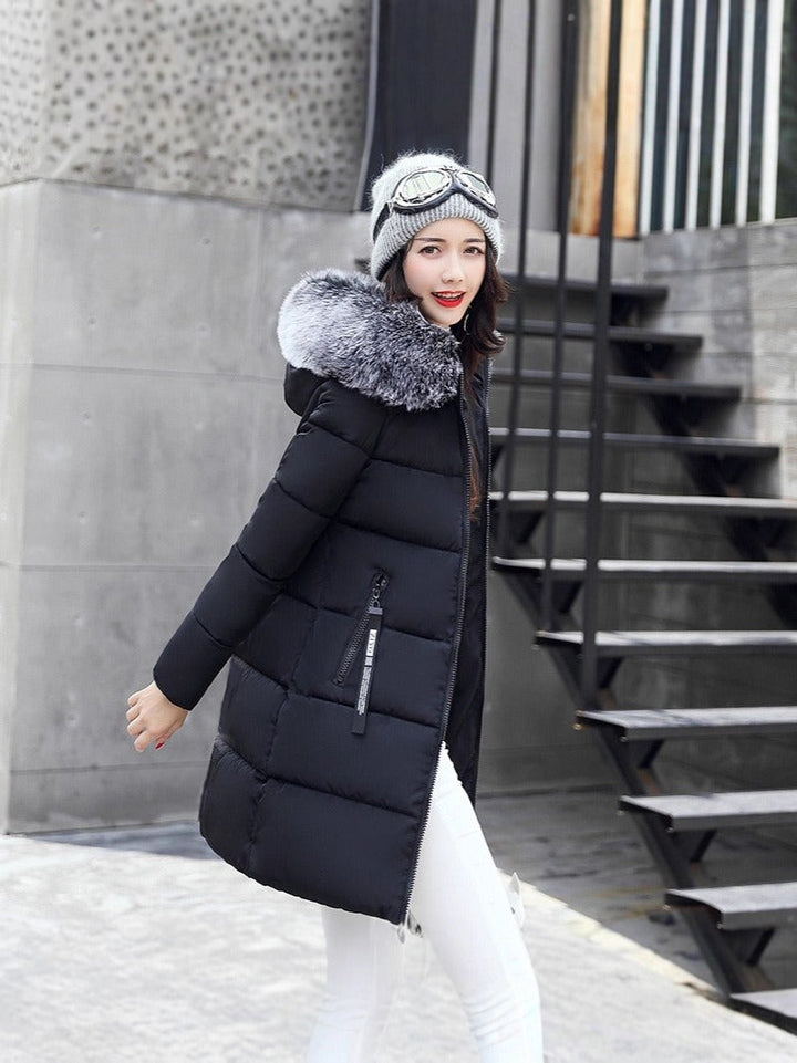 Stylish women's insulated long winter parka with a hood. Stay warm & fashionable in cold weather outdoor adventures.