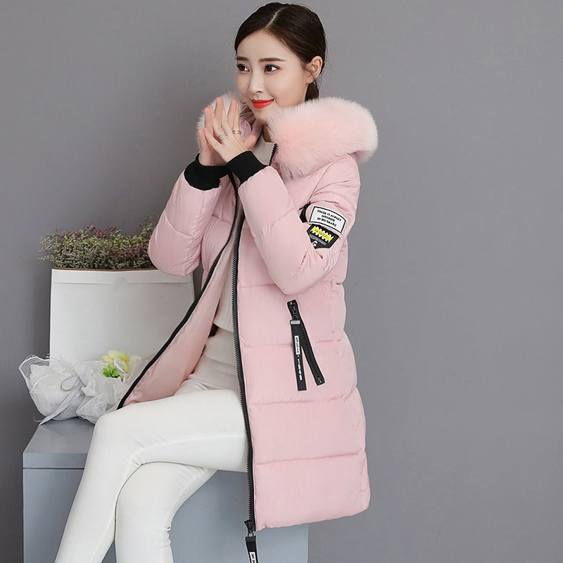 Insulated women's hooded long parka. A warm winter coat designed for ultimate cold weather protection & style.
