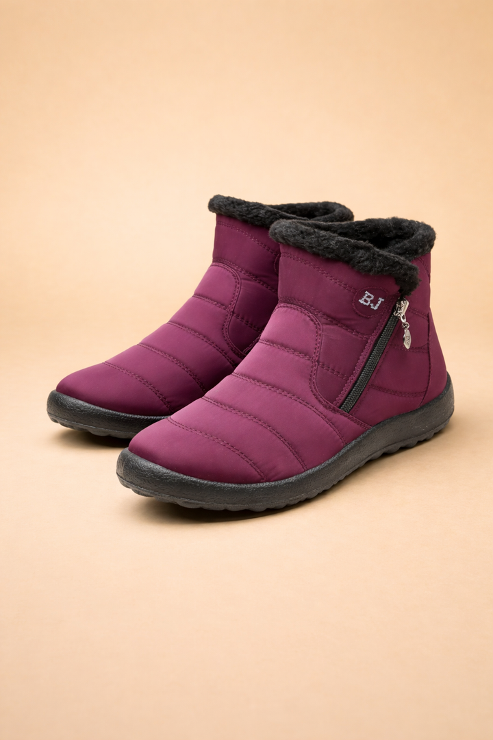 Stylish women's snow boots, comfortable & warm with a convenient side zip for easy wear.