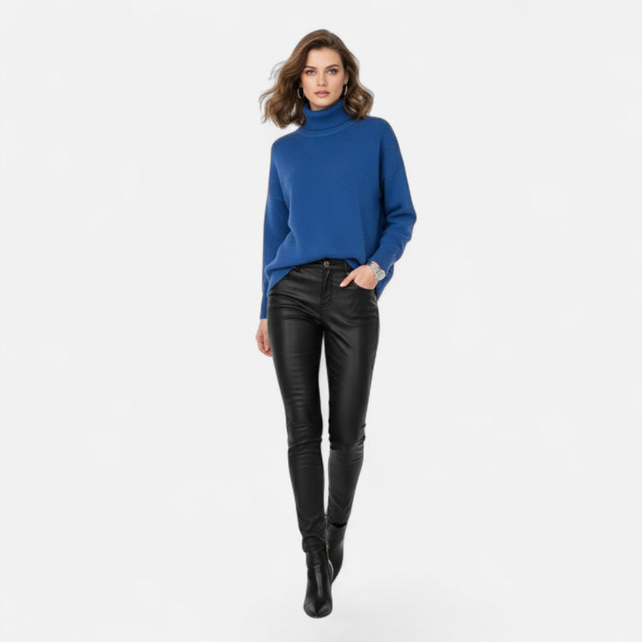 Women's oversized sweater with turtleneck, providing warmth & a chic, relaxed fit.