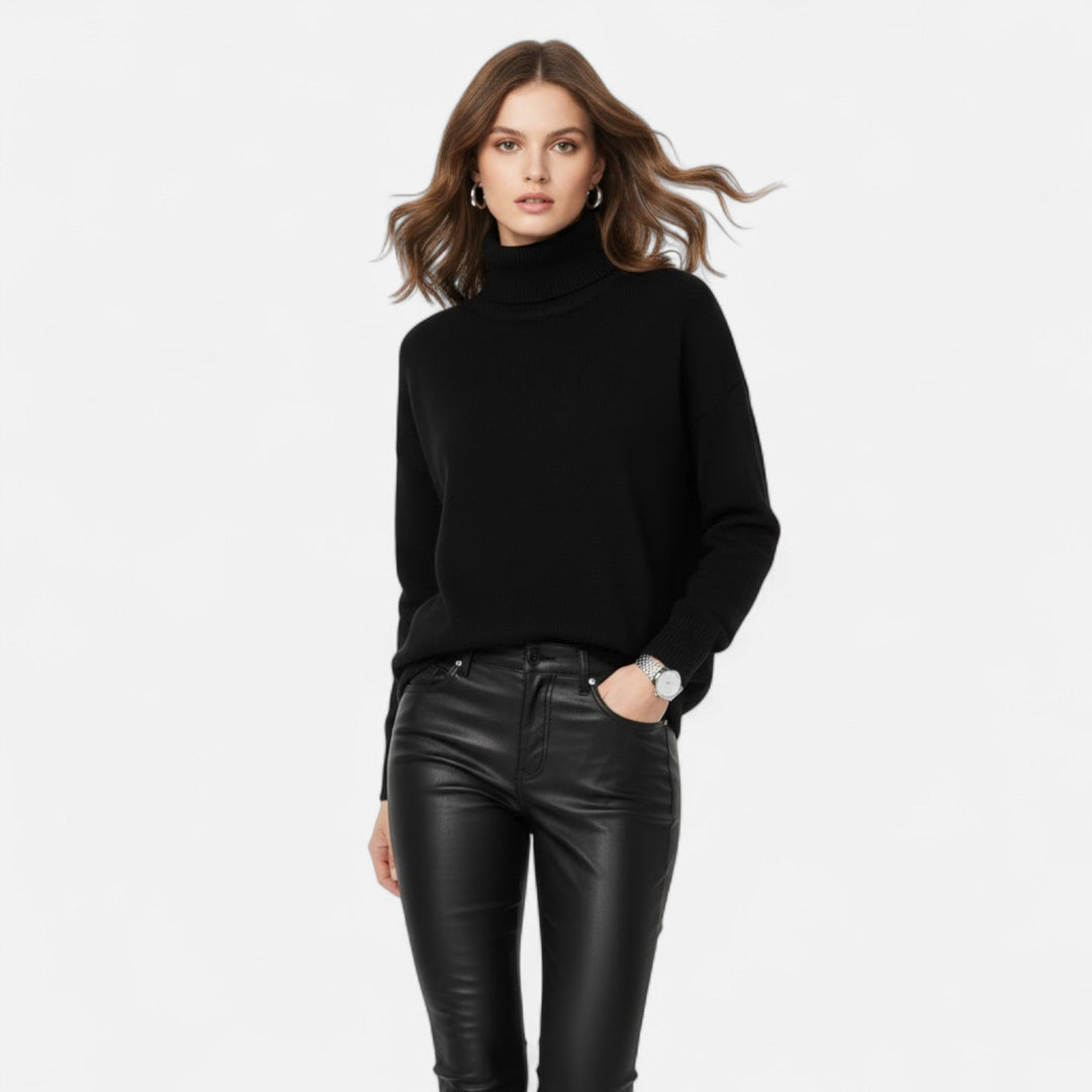 Oversized women's cozy turtleneck sweater, perfect for stylish winter warmth.
