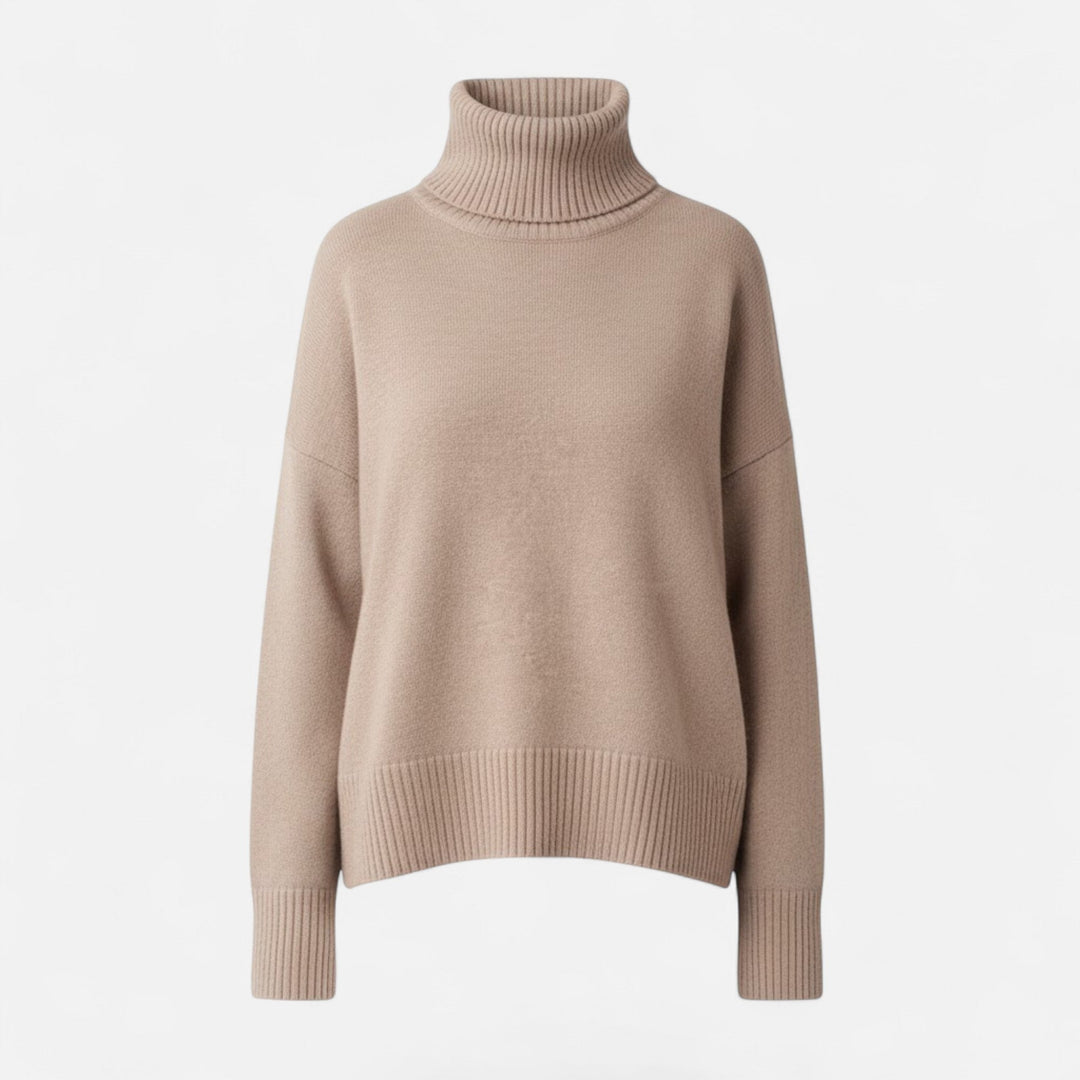 Chunky knit women's turtleneck, offering a relaxed fit & cozy autumn style.