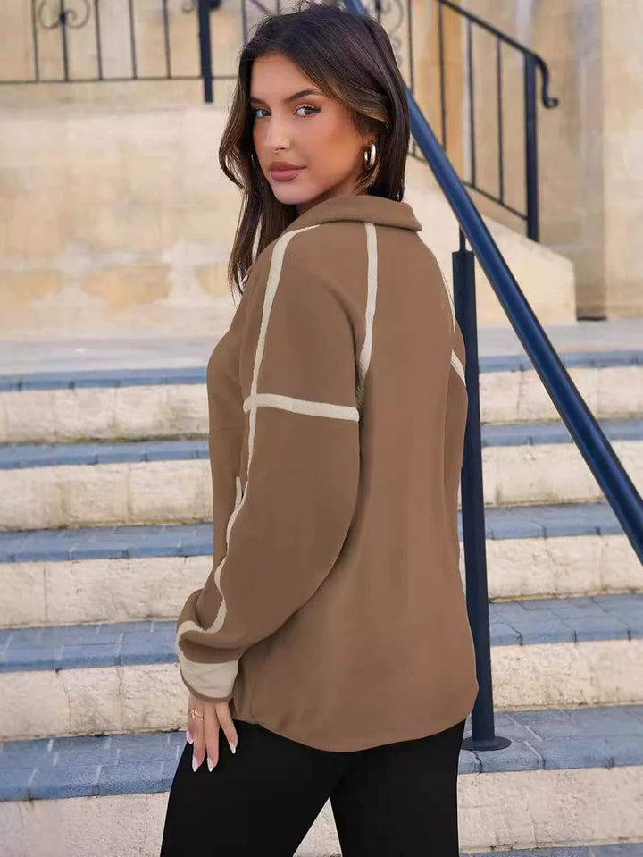 Warm women's cozy quarter-zip pullover sweater, soft fabric for ultimate comfort in cold weather.