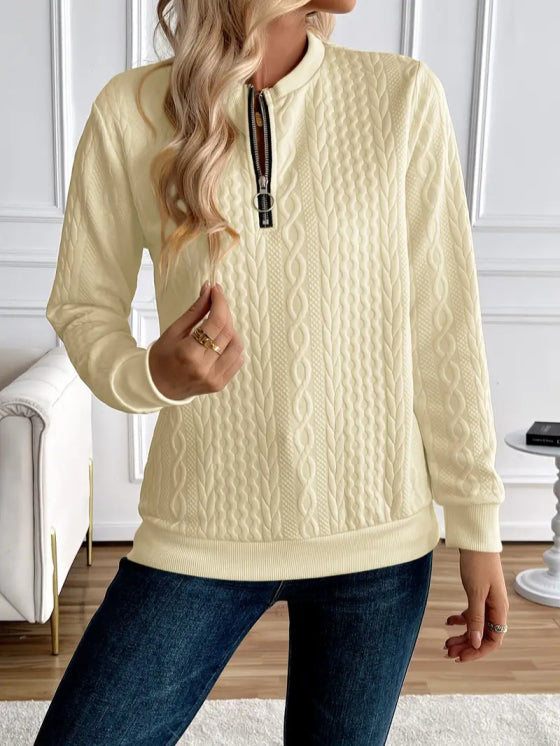 Soft quilted zip-up sweater for women, offering cozy warmth and elegant style for cold weather.