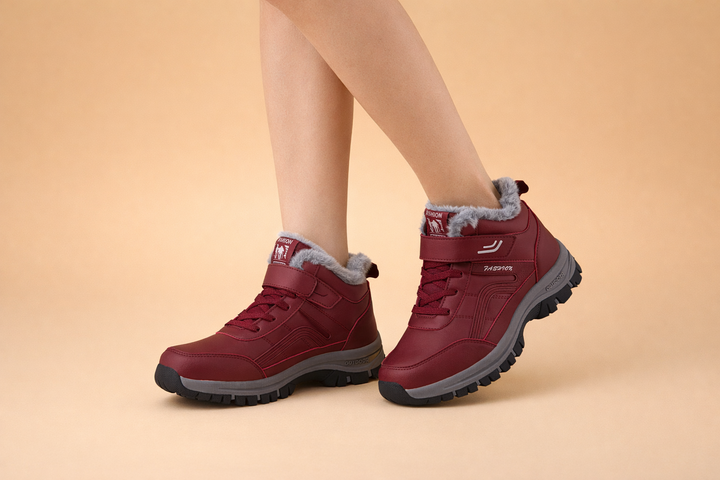Women's warm and cozy ankle boots, waterproof for winter. Features a sleek design for everyday cold weather style.
