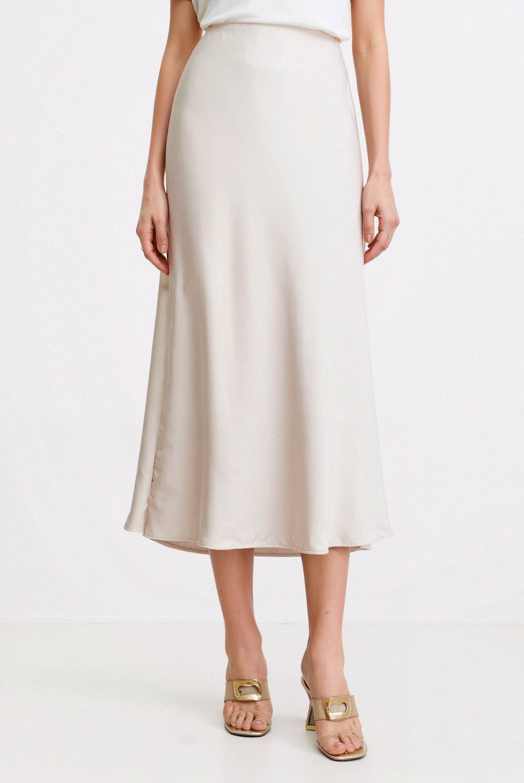 Women's cream white high waist flowing maxi skirt, ideal for elegant summer fashion or casual wear.