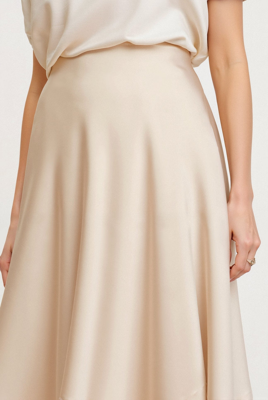 Boho-style women's flowing maxi skirt in cream white with a high waist, perfect for summer outfits.