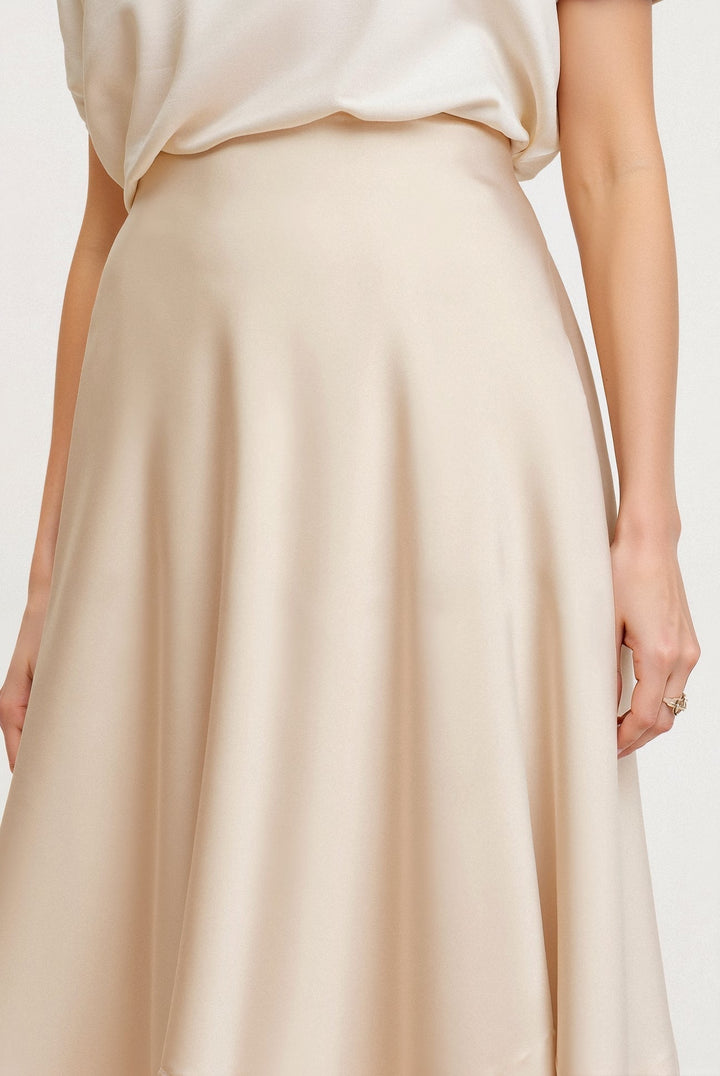 Boho-style women's flowing maxi skirt in cream white with a high waist, perfect for summer outfits.