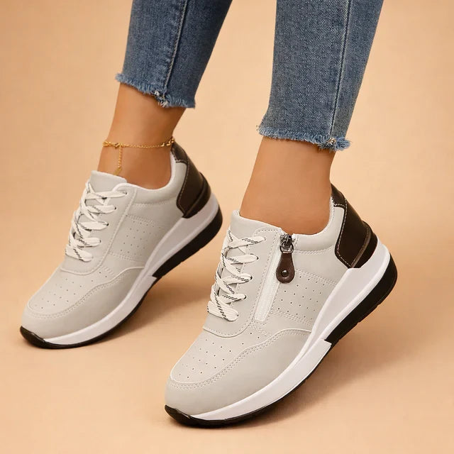 Women's cushioned low-top sneakers in white, perfect for everyday comfort and casual walking.