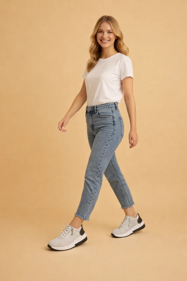 Modern women's low-top sneakers featuring a sleek perforated design and plush cushioning for versatile casual style.