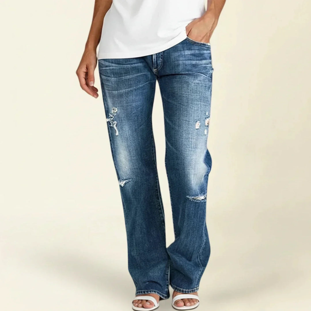 Women's dark wash ripped high-rise straight leg jeans, perfect for casual summer fashion.