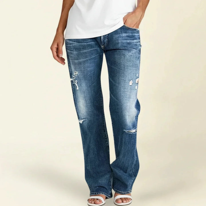 Women's dark wash ripped high-rise straight leg jeans, perfect for casual summer fashion.