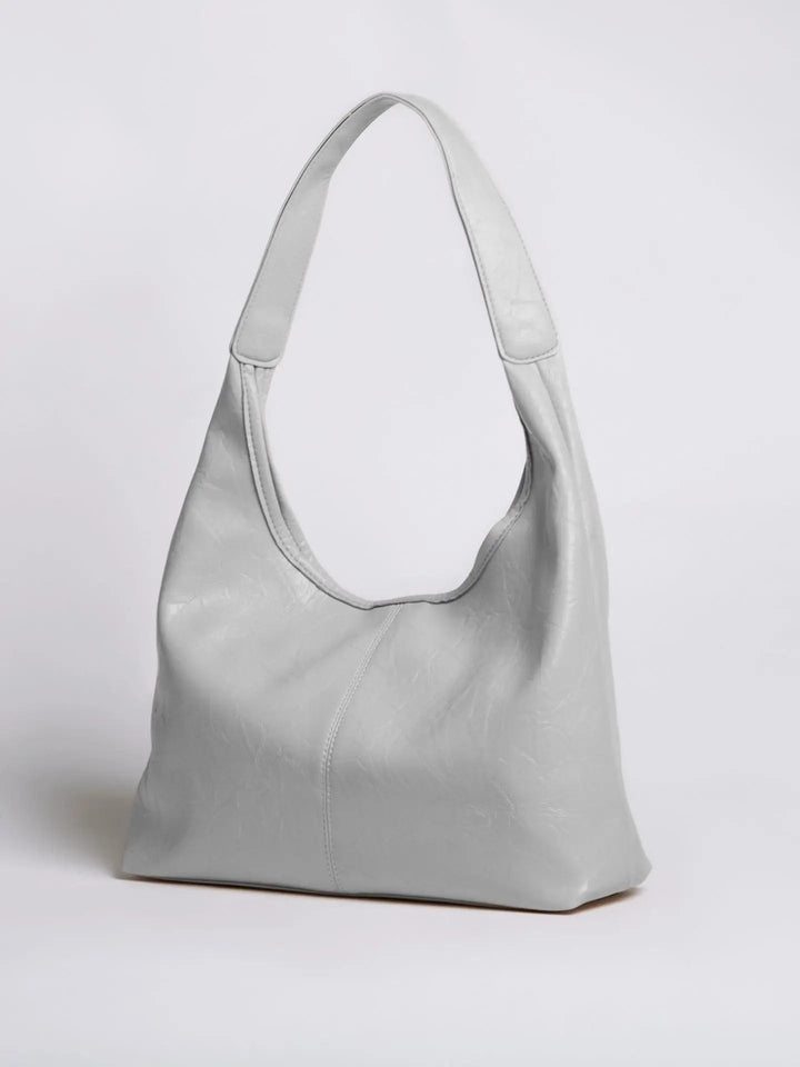 Minimalist distressed leather tote, an elegant everyday bag for women