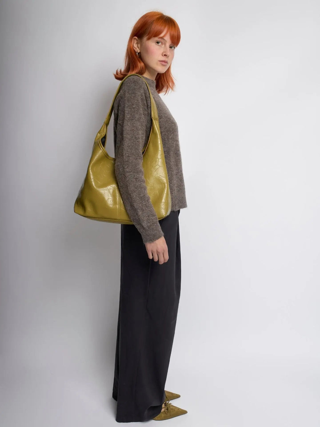 Distressed leather tote with subtle branding, an understated women's handbag