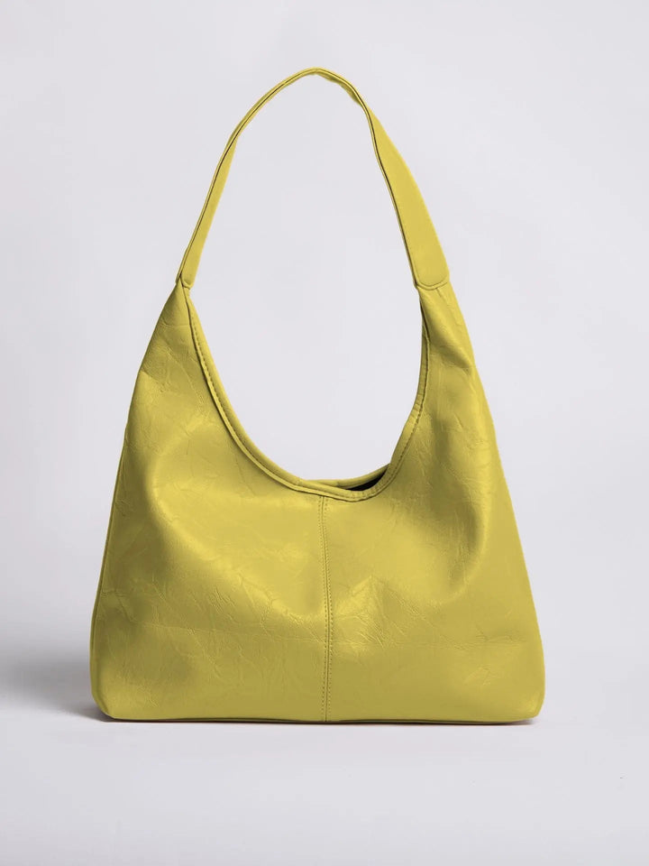 Vintage-inspired distressed leather tote, a timeless women's shoulder bag