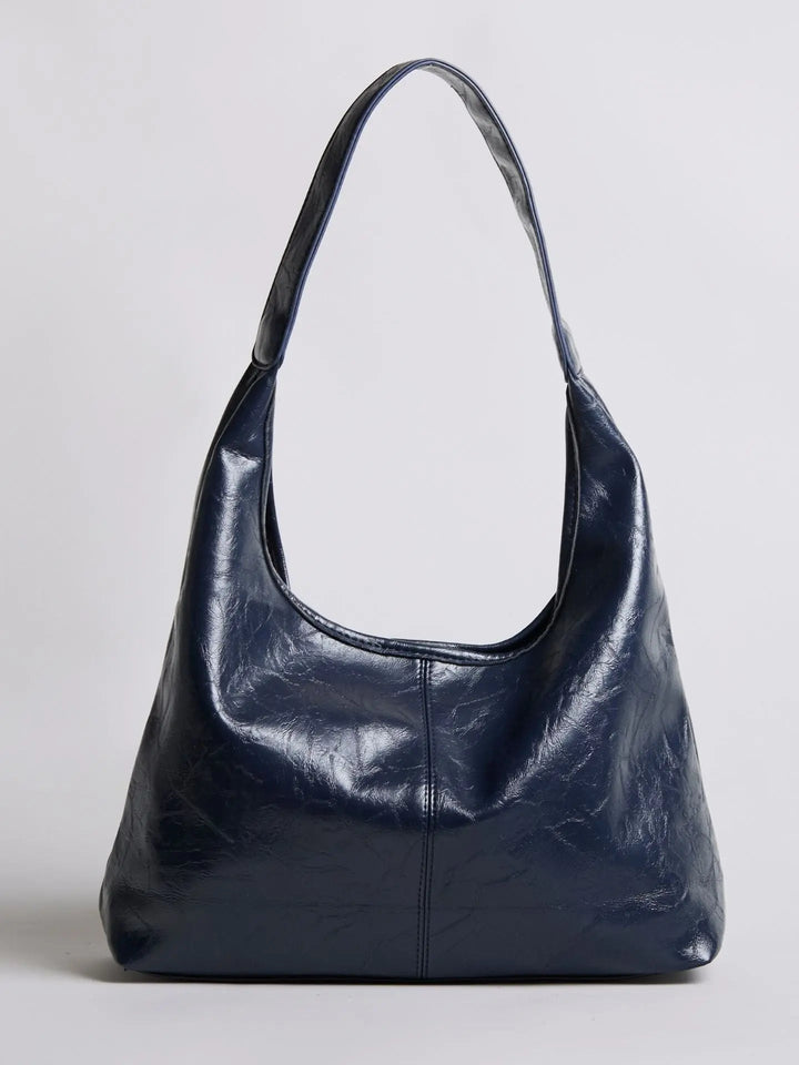 Distressed leather tote with a textured finish, a stylish women's handbag