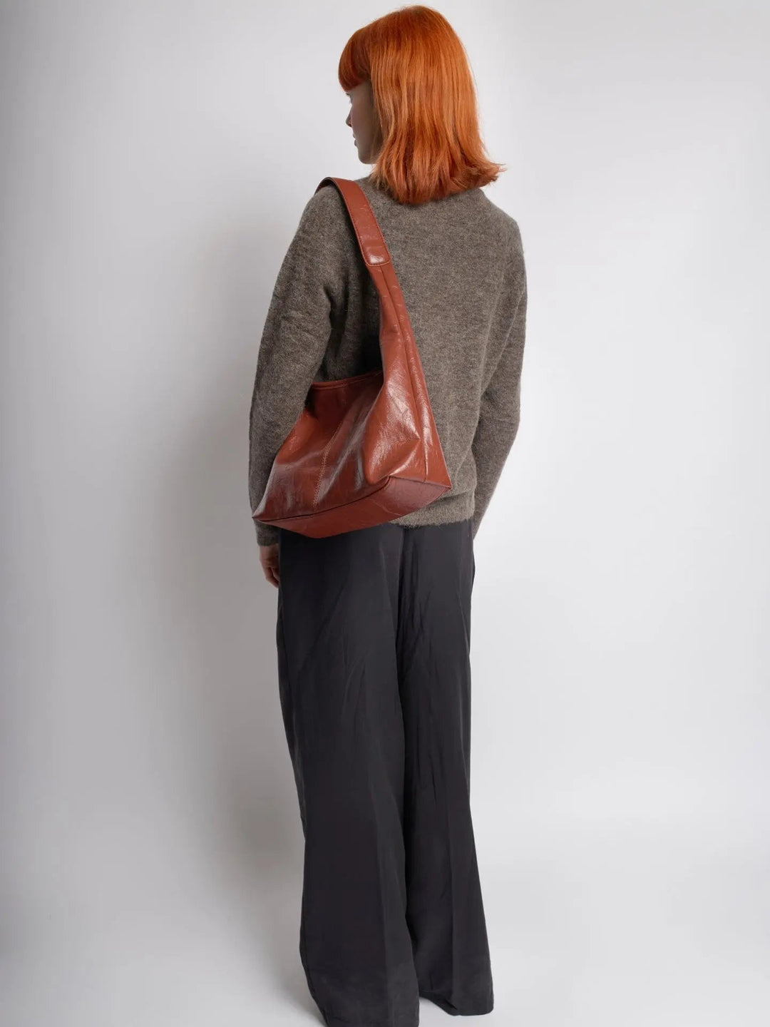 Distressed leather tote with a simple design, a minimalist women's bag