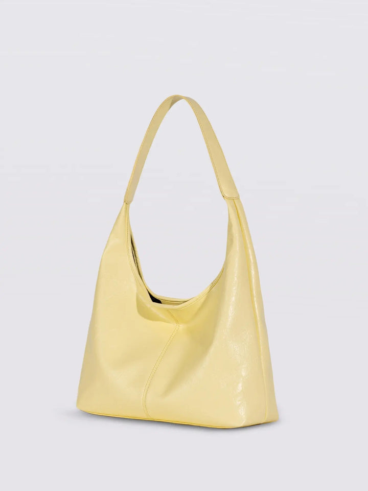 Distressed leather tote with contrasting stitching, an eye-catching women's bag