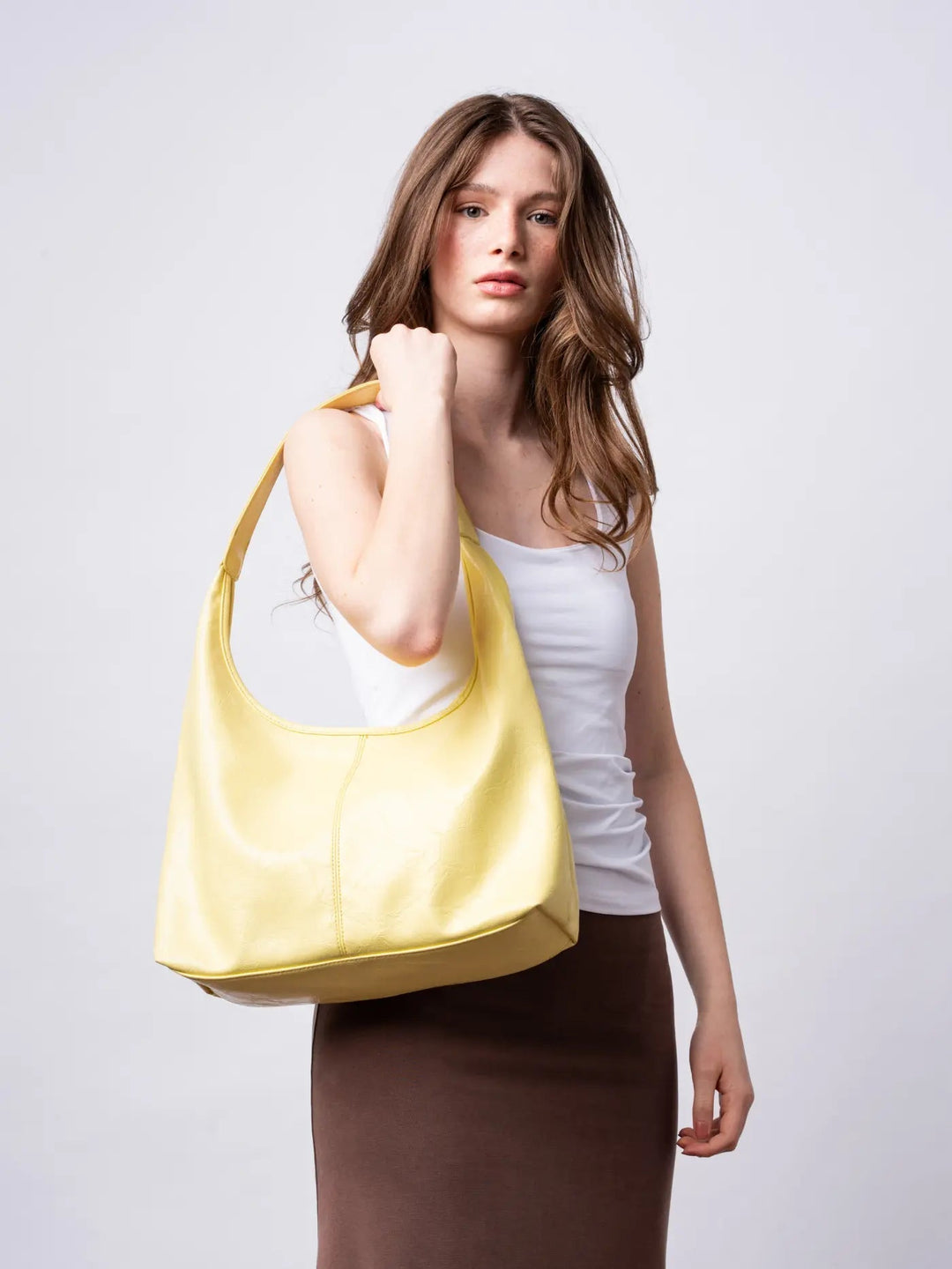 Boho-chic distressed leather tote, a free-spirited women's shoulder bag