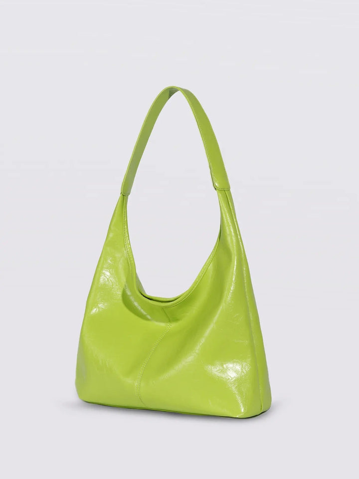 Side view of distressed leather tote, showing depth and silhouette