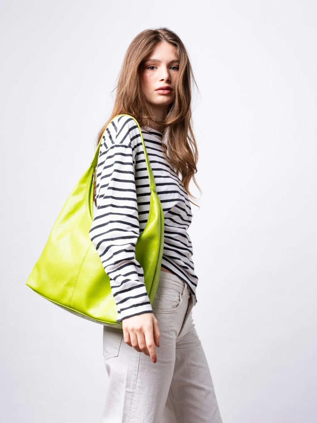 Distressed leather tote with metallic hardware, a subtle accent for women