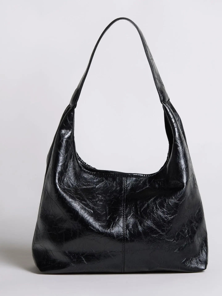 Distressed leather tote with a smooth back panel, for comfortable wear