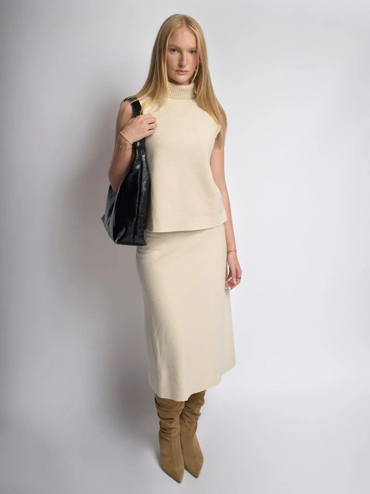 Women's distressed leather tote paired with a casual outfit, everyday look
