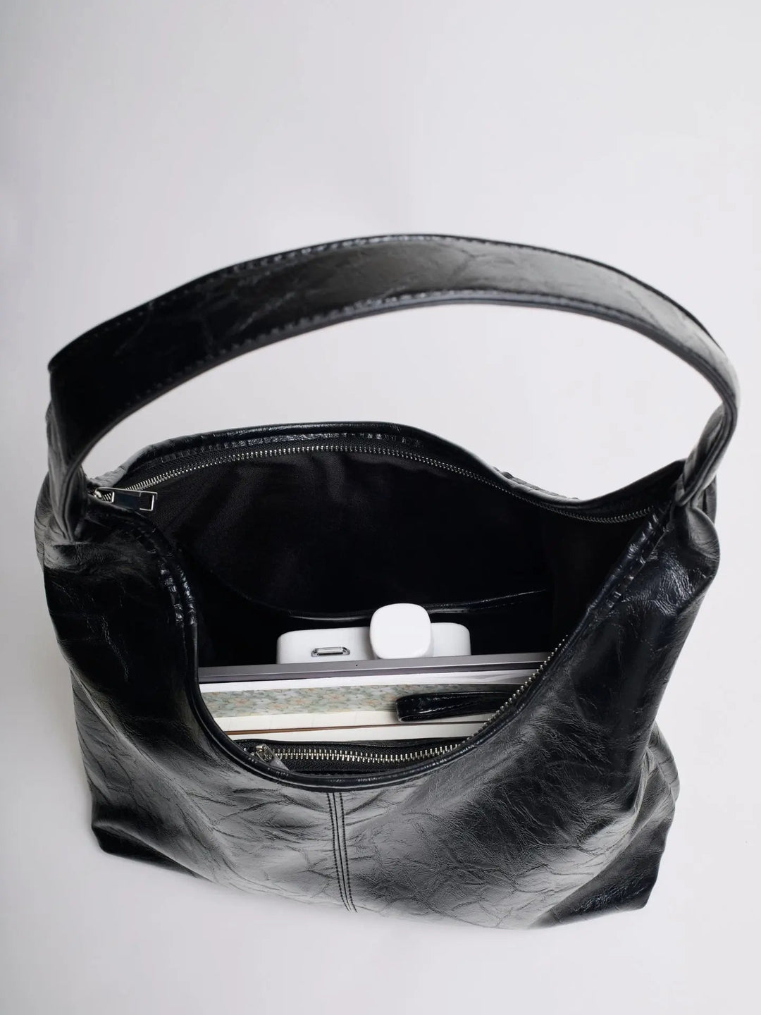 Distressed leather tote placed on a table, ready for daily use