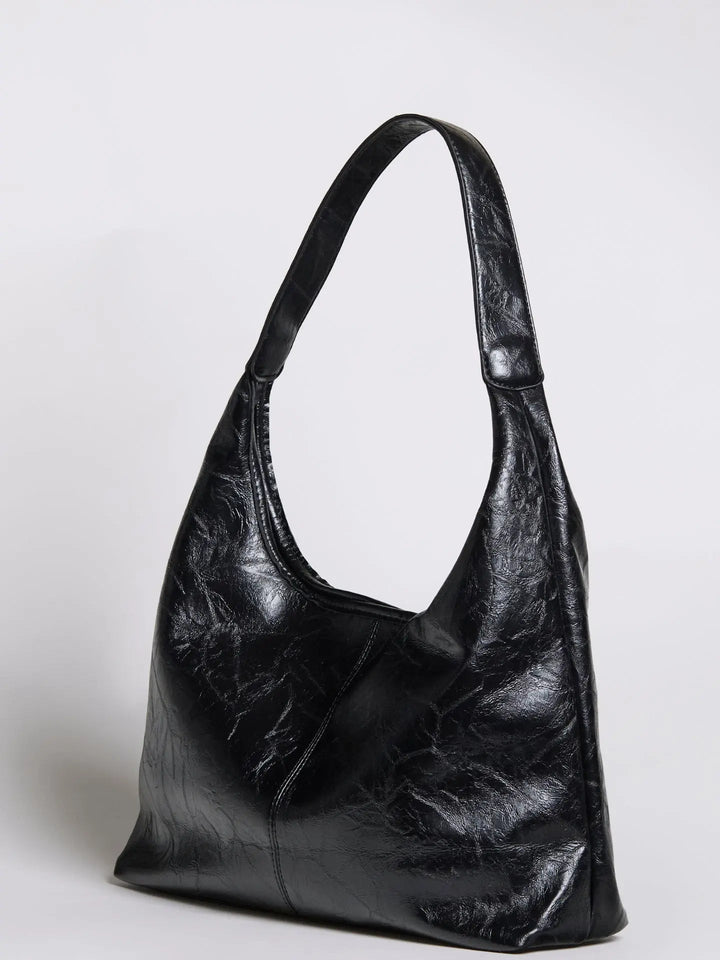 Women's distressed leather tote with a long shoulder strap option