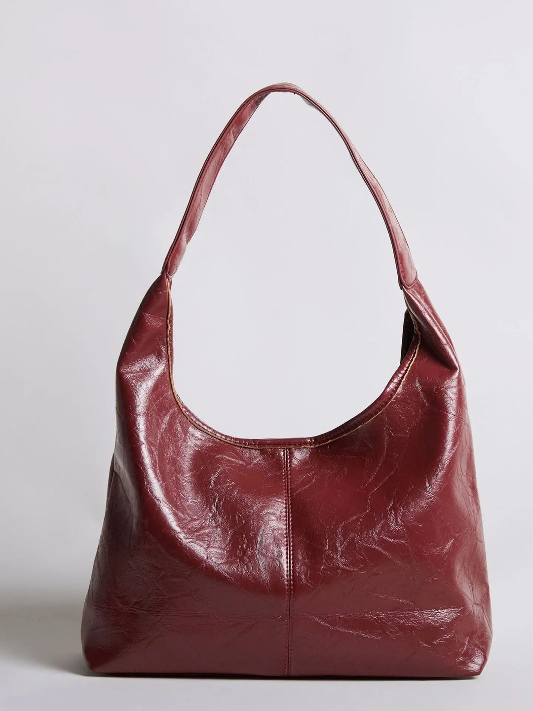 Distressed leather tote with a short handle for hand carry, versatile bag