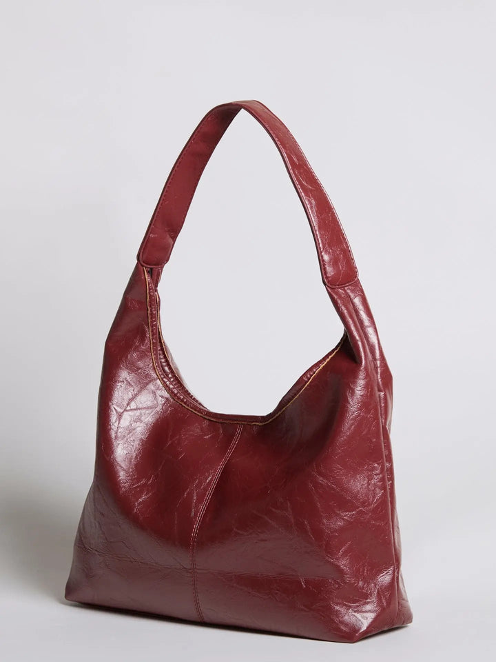 Minimalist distressed leather tote for women, ideal as a handbag