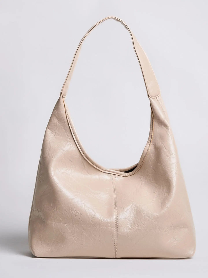 Sustainable distressed leather tote, eco-conscious women's fashion choice