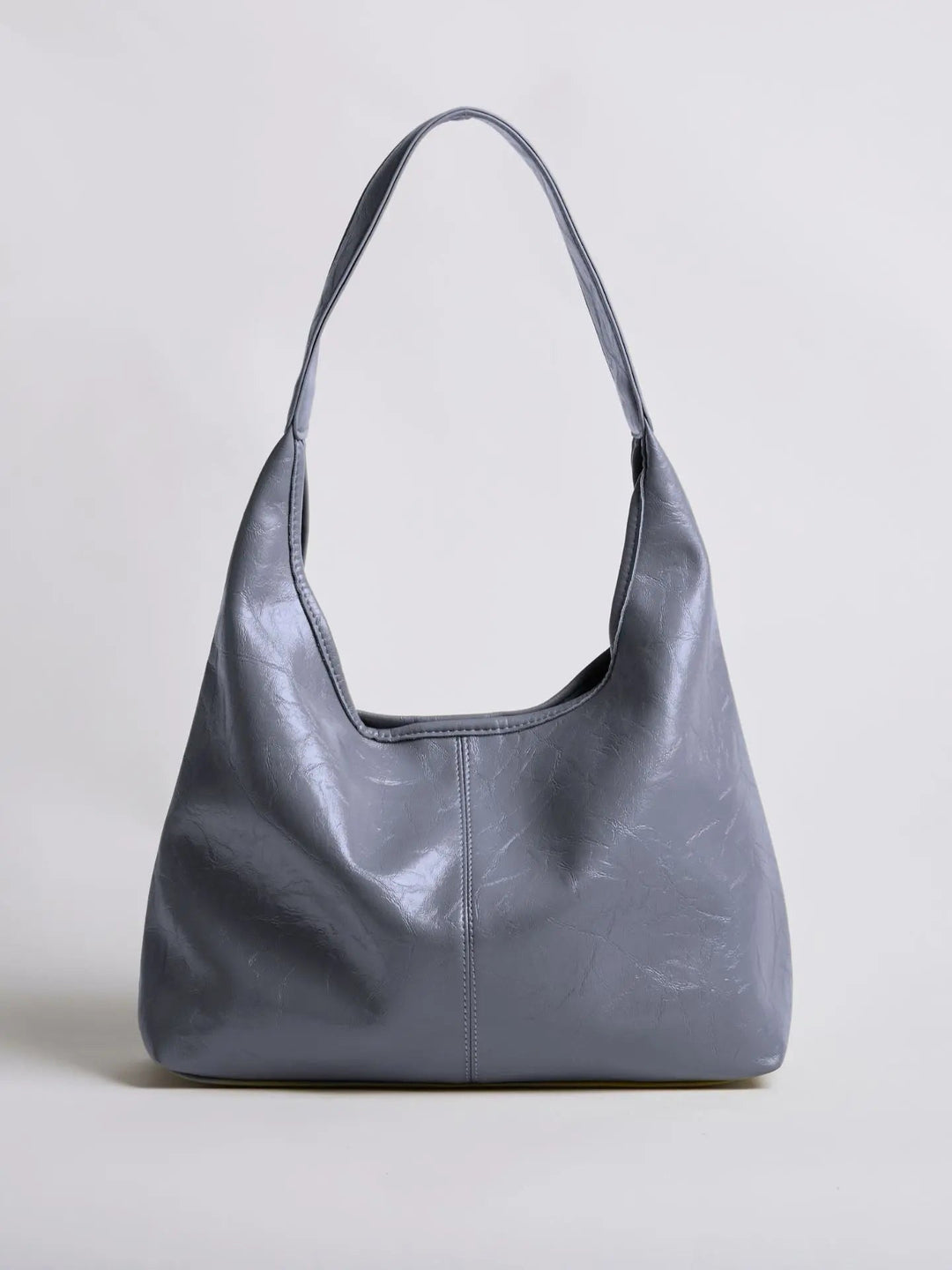 Distressed leather tote with a distinct patina, telling a story of use