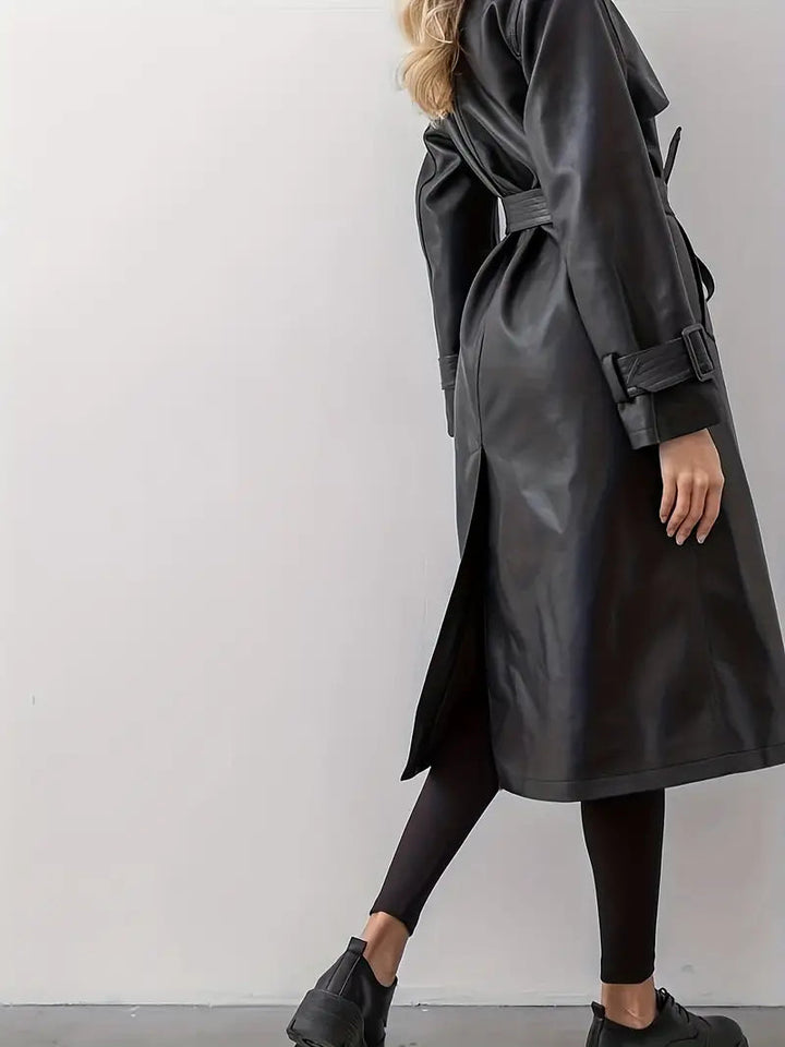 Black faux leather women's trench coat, double-breasted style with a cinched waist belt.
