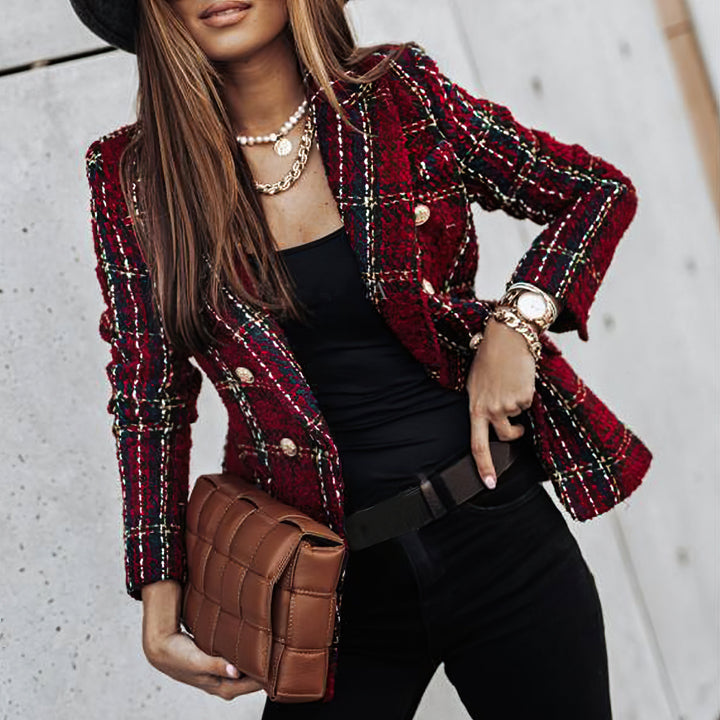 Close-up of a women's double breasted plaid jacket, highlighting the check pattern and fabric.